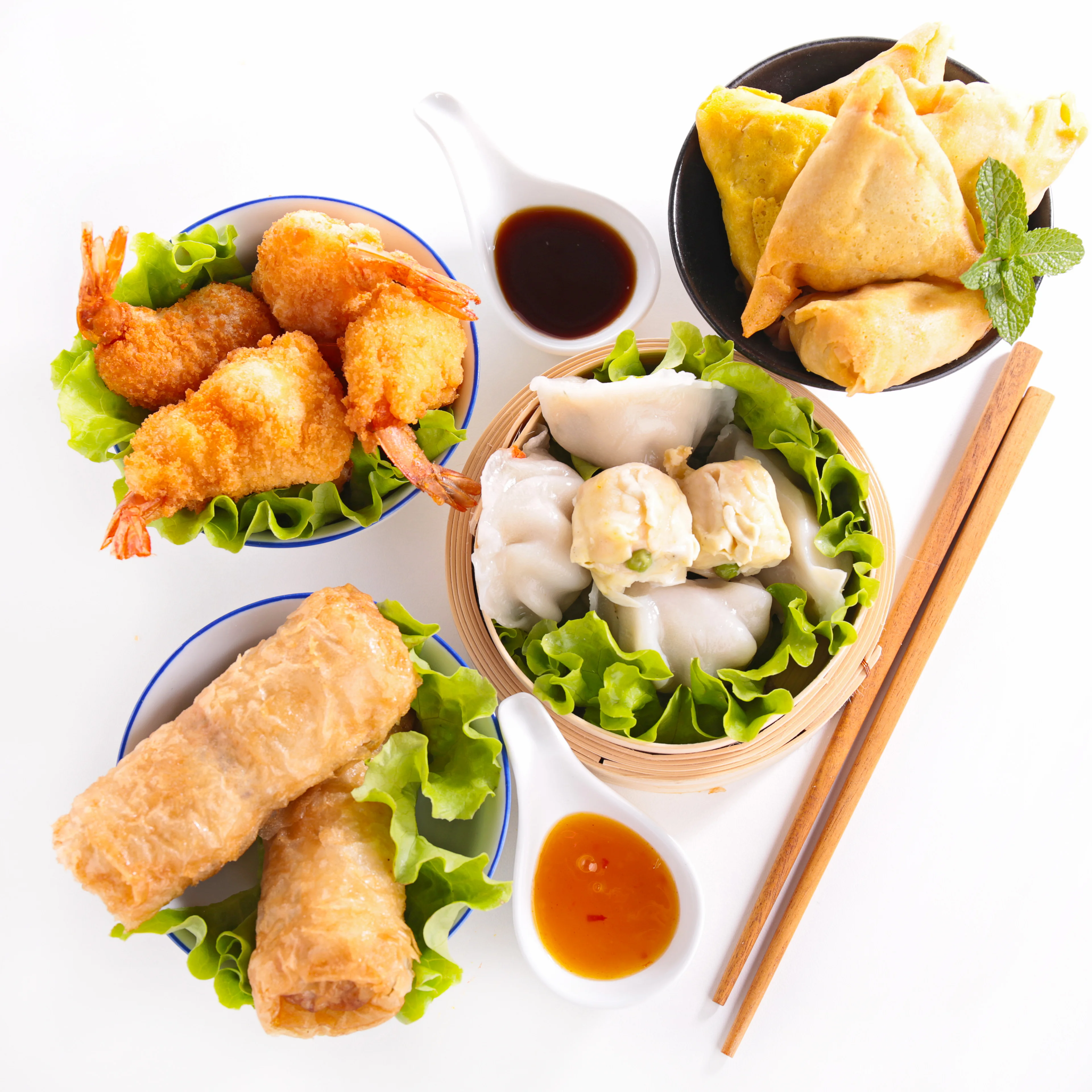 Assorted Asian dim sum platter with shrimp and spring rolls
