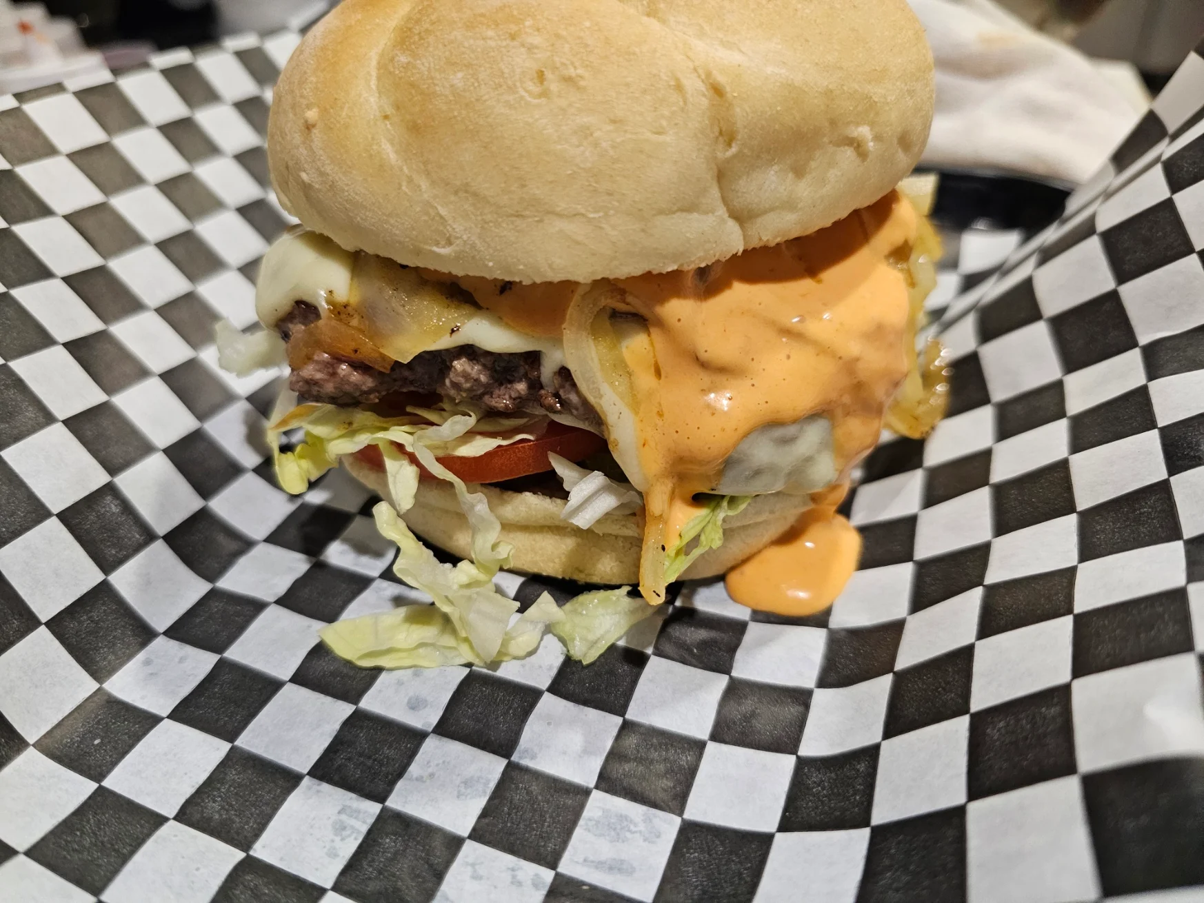 Juicy cheeseburger with special sauce and fresh toppings