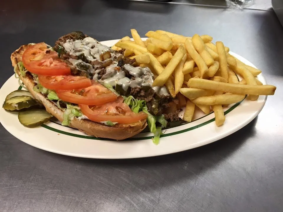 Delicious gourmet burger with fresh toppings on a wooden table