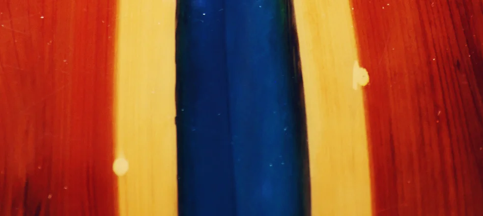 Colorful wooden surface with blue and red resin inlay