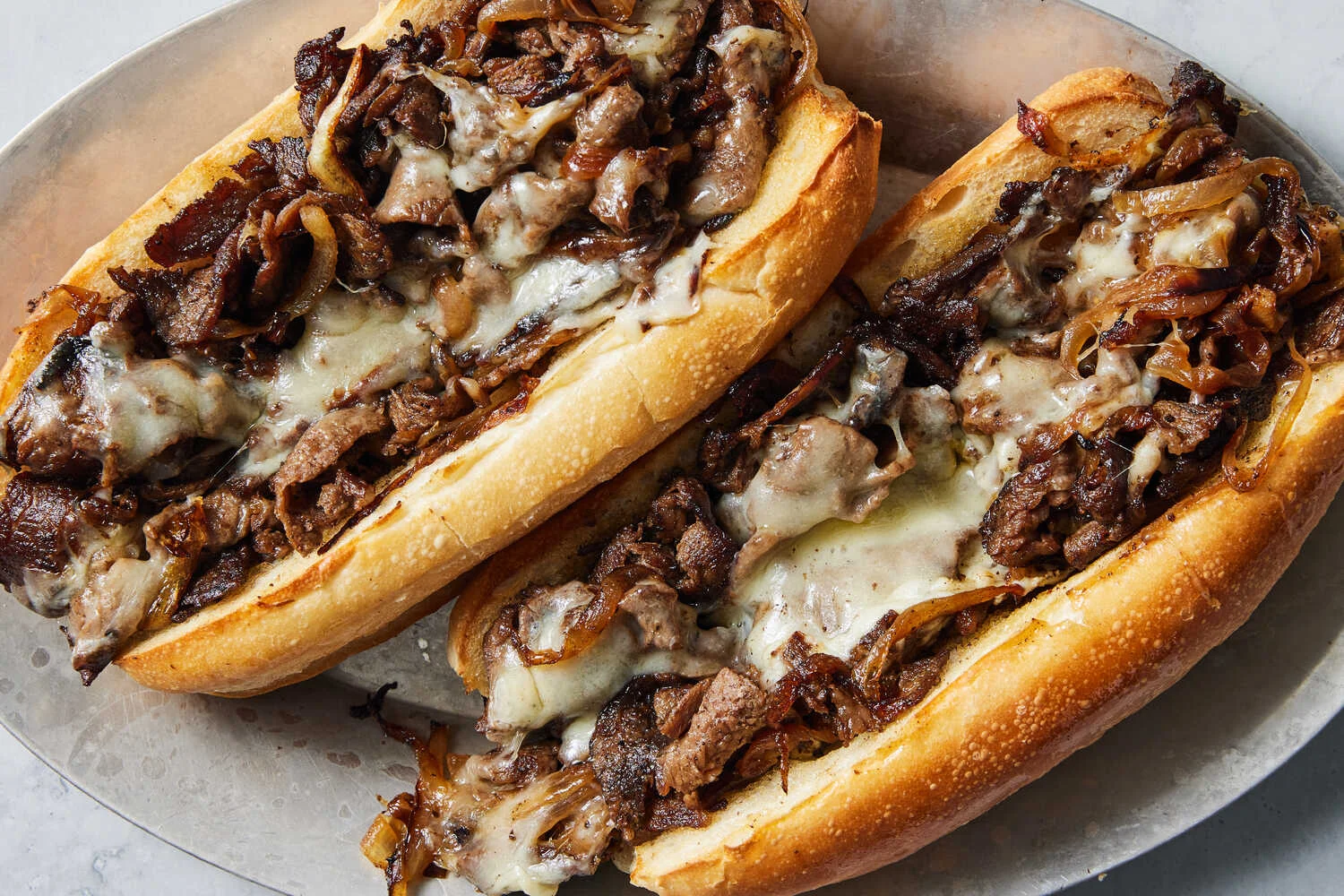 Philly cheesesteak sandwich with melted cheese and grilled onions