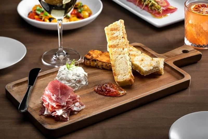 Charcuterie board with cured meats and spreads