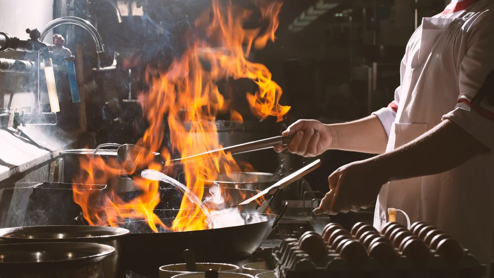 A restaurant chef preparing a dish