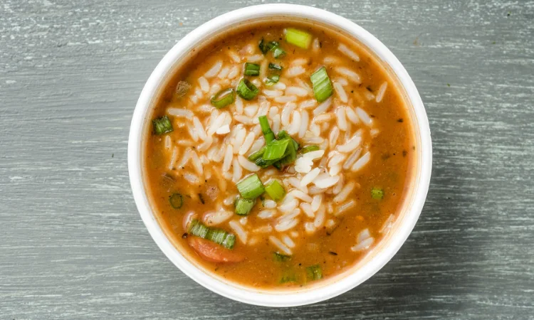 Chicken and sausage gumbo from VooDoo BBQ in Pensacola, served with rice and topped with green onions.
