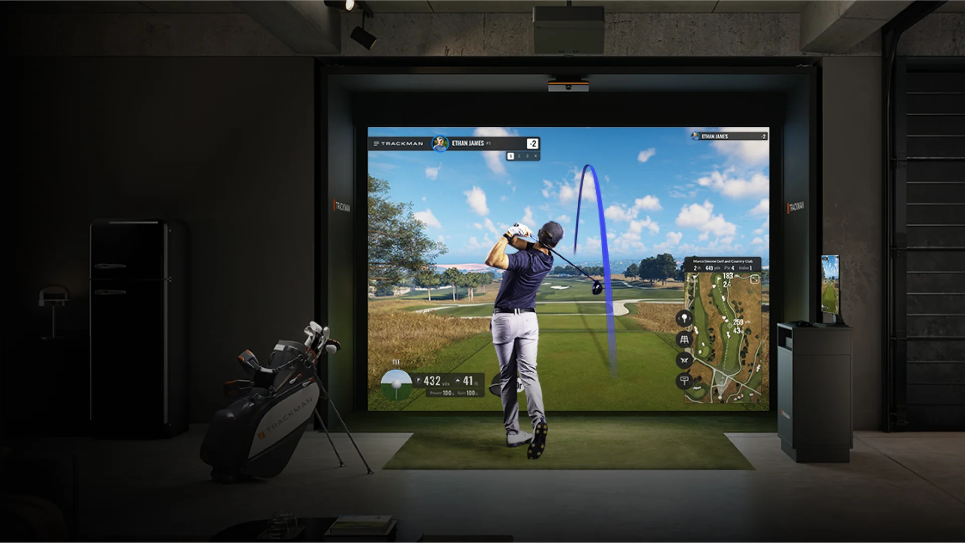 Indoor golf simulator with player swinging club