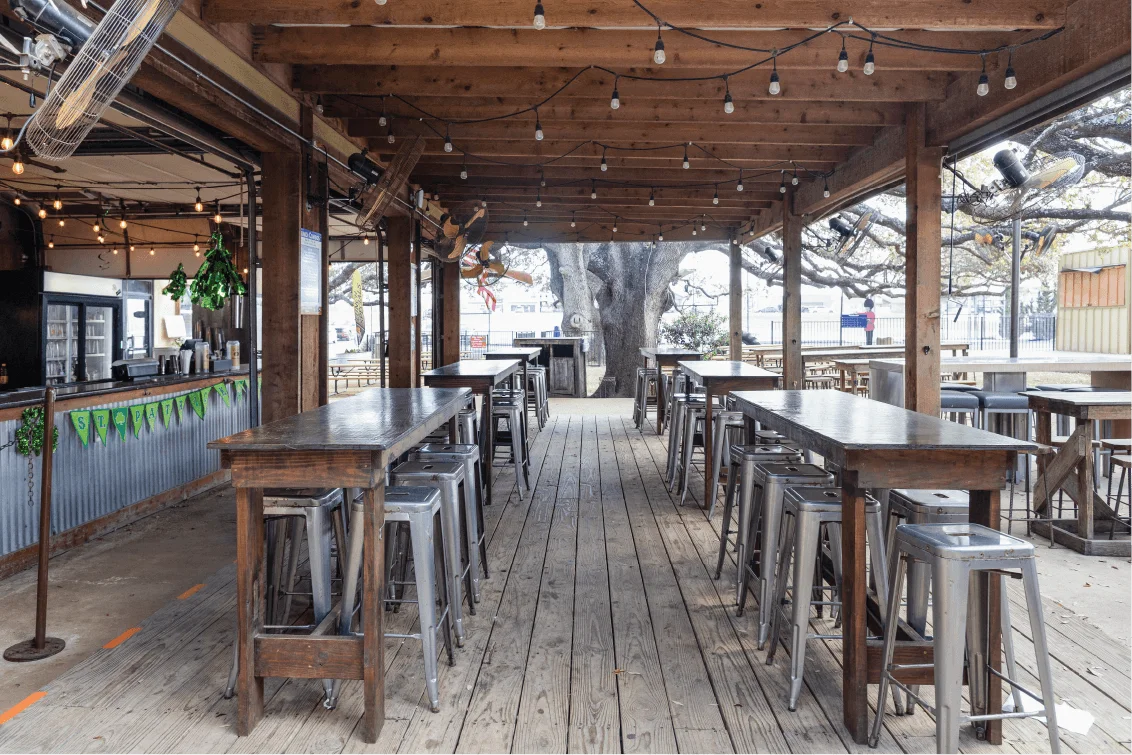 Delicious gourmet burger with fresh toppings on a wooden table