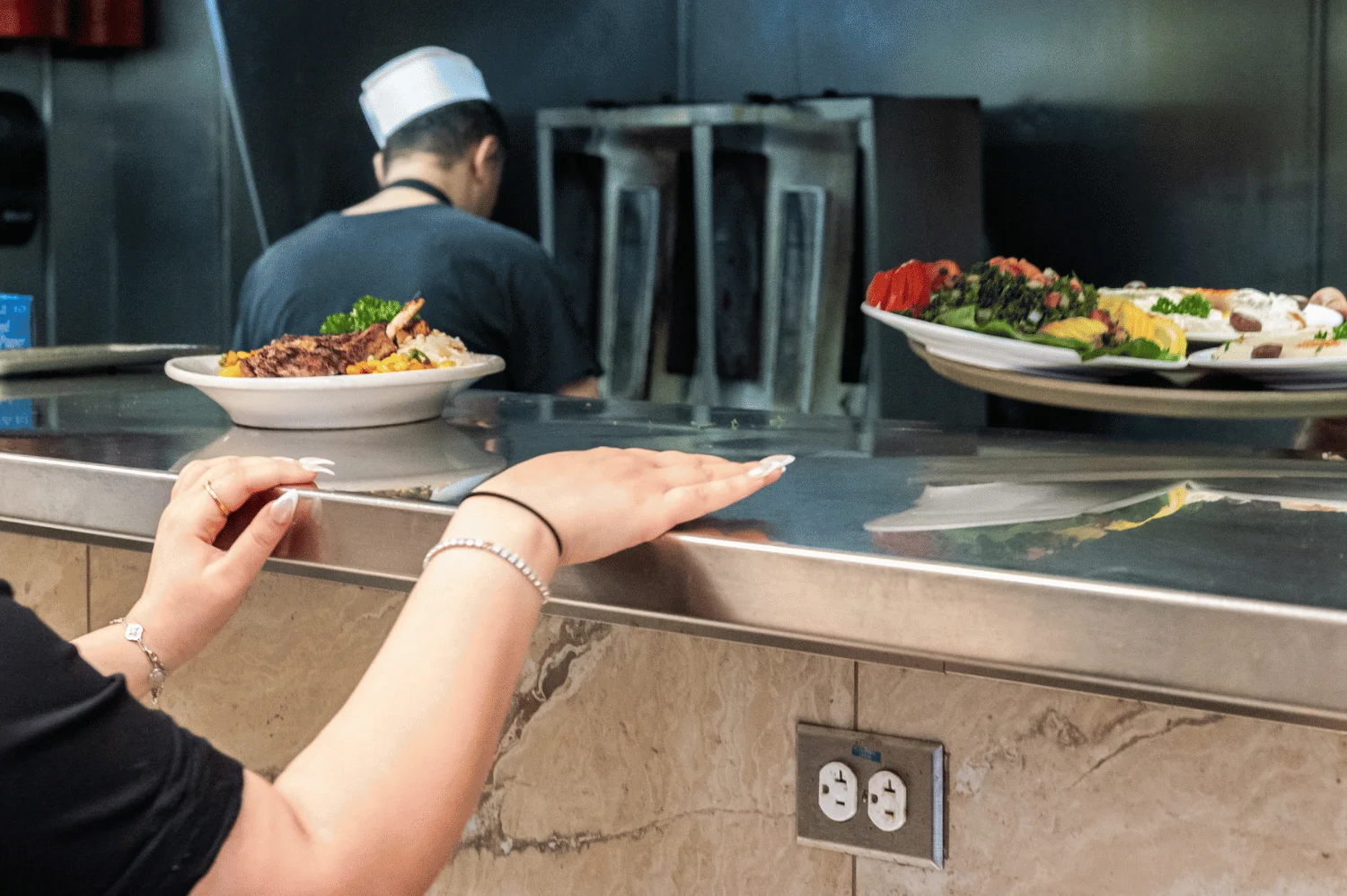 Team member collecting customers food order