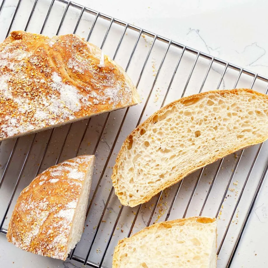 Artisan sourdough bread on a cooling rack