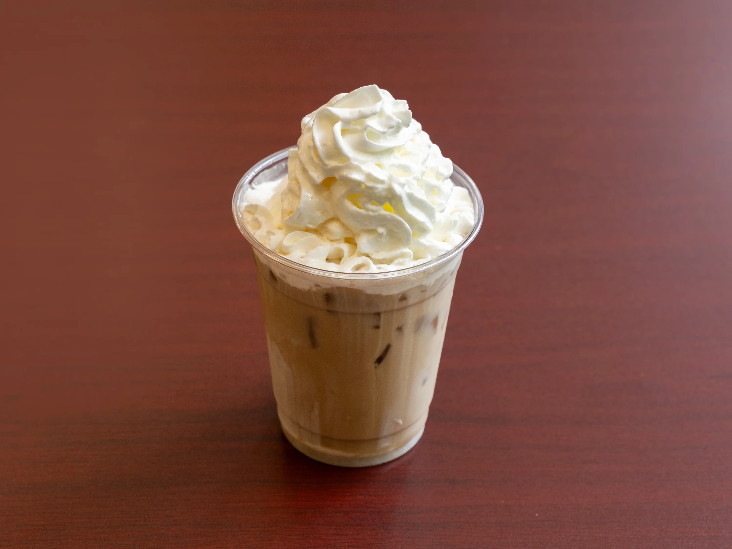 Iced coffee topped with whipped cream