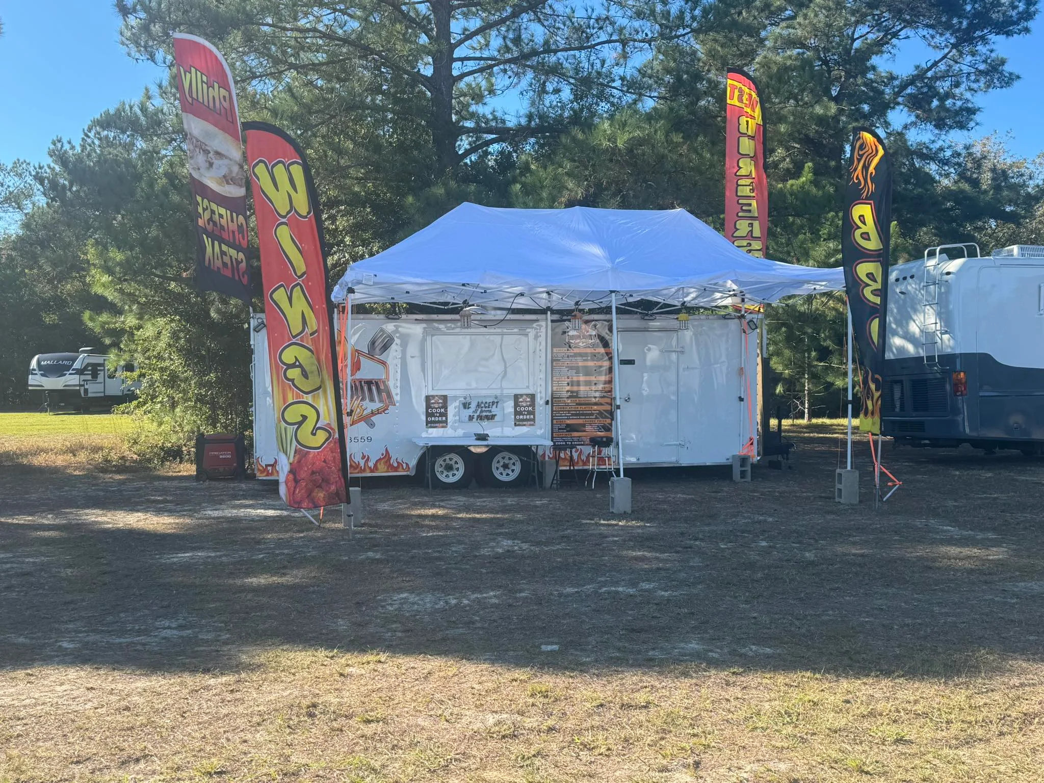 A vibrant food truck serving delicious meals at an outdoor event.