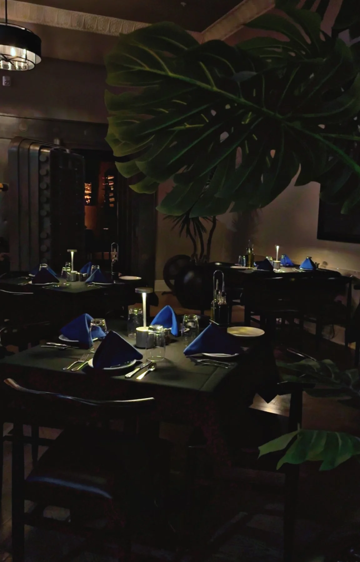 Elegant restaurant interior with blue accents and ambient lighting