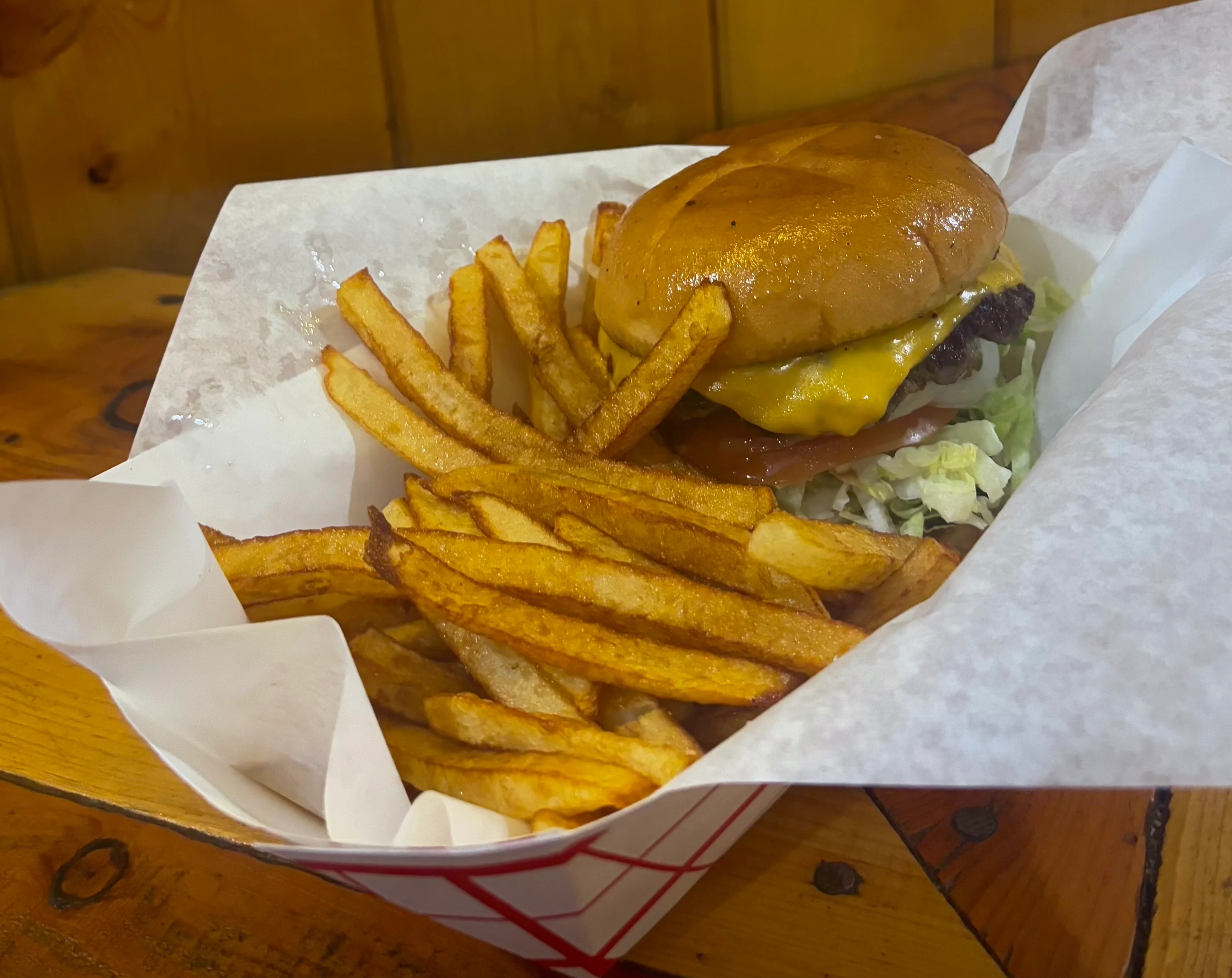 Classic American cheeseburger with fries