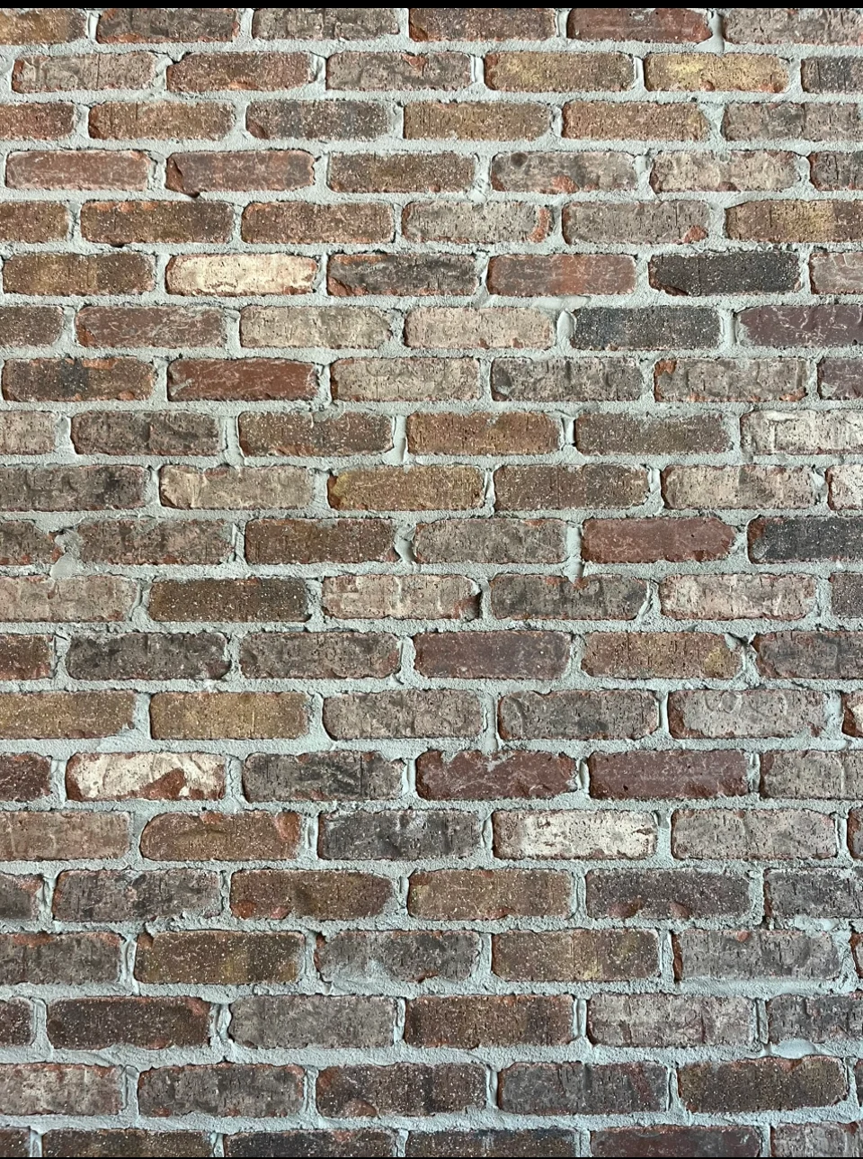 Exposed brick wall in a cozy restaurant interior