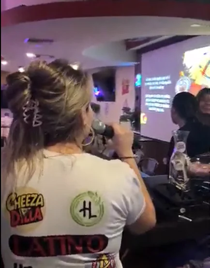 Karaoke night at a lively restaurant with guests enjoying music