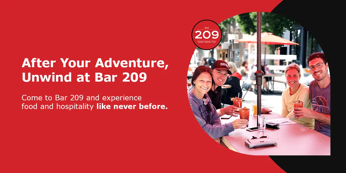 Group enjoying drinks at Bar 209 outdoor seating
