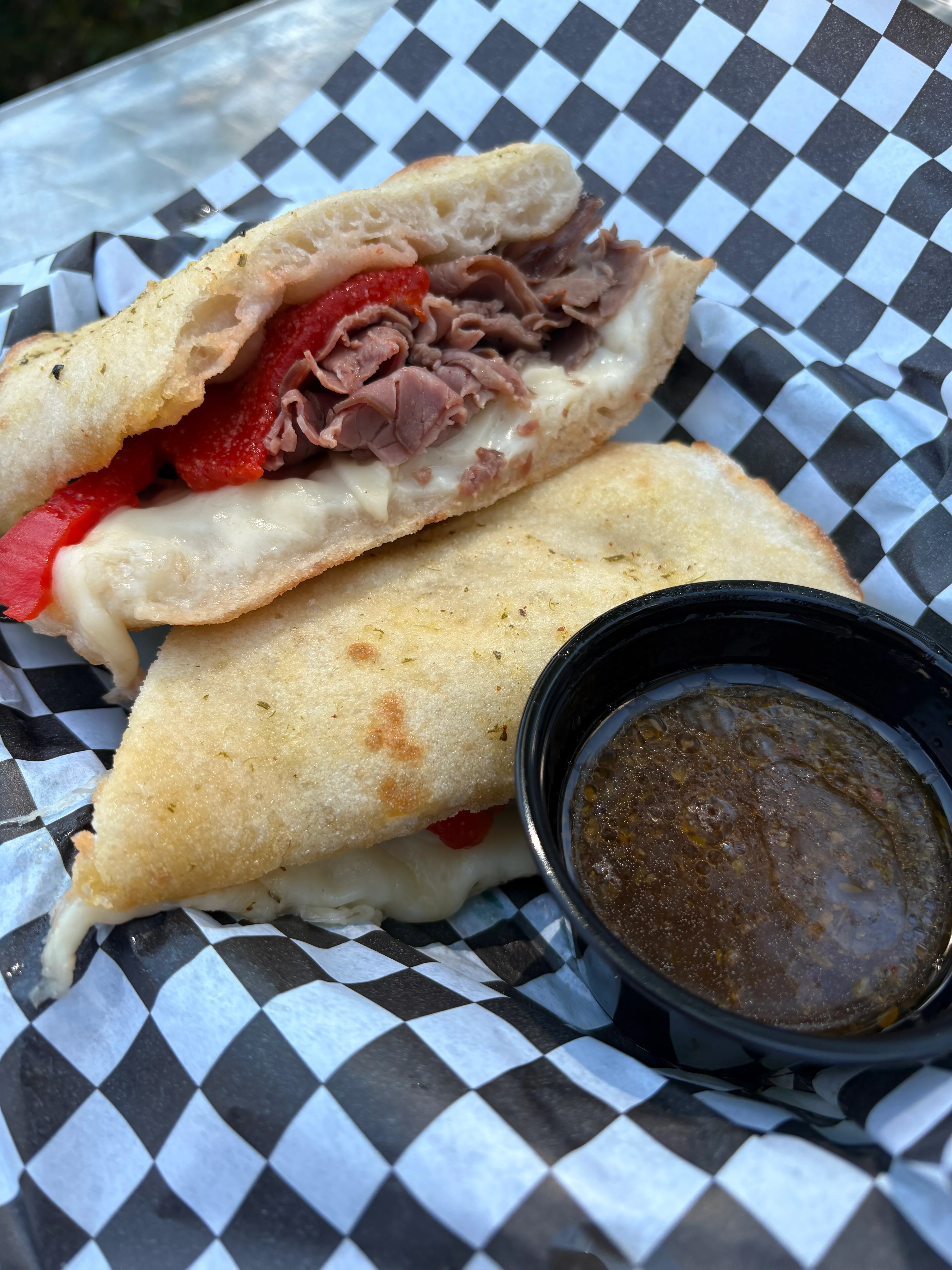 Italian beef sandwich with roasted peppers and cheese
