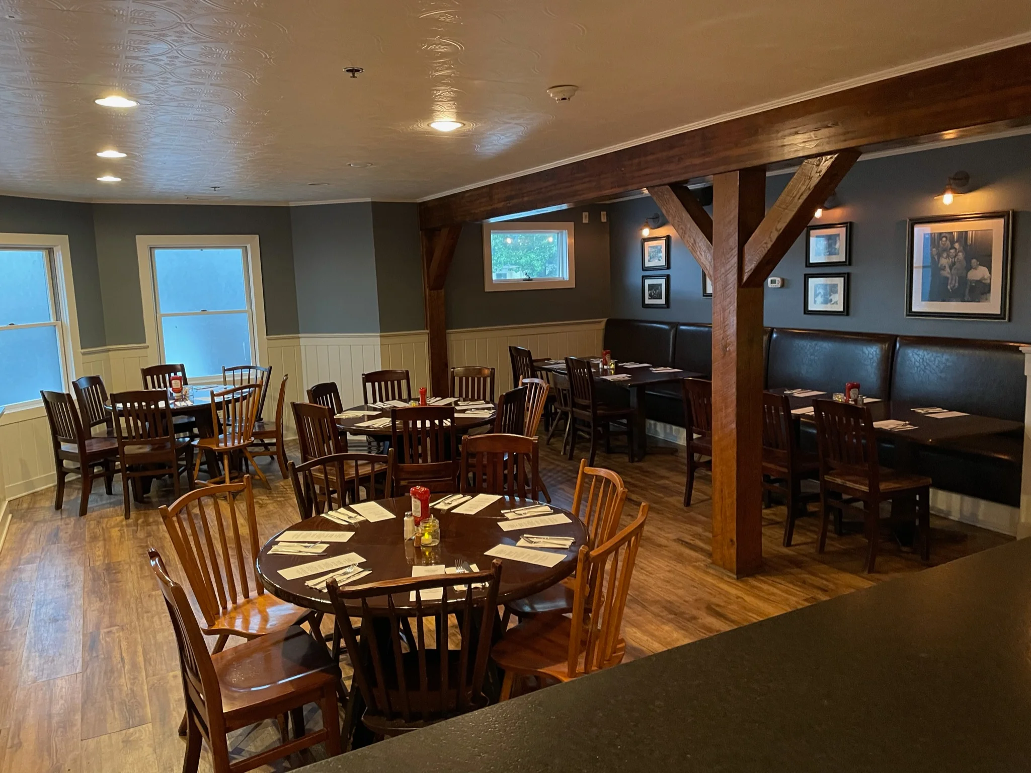 Cozy restaurant interior with wooden tables and warm lighting