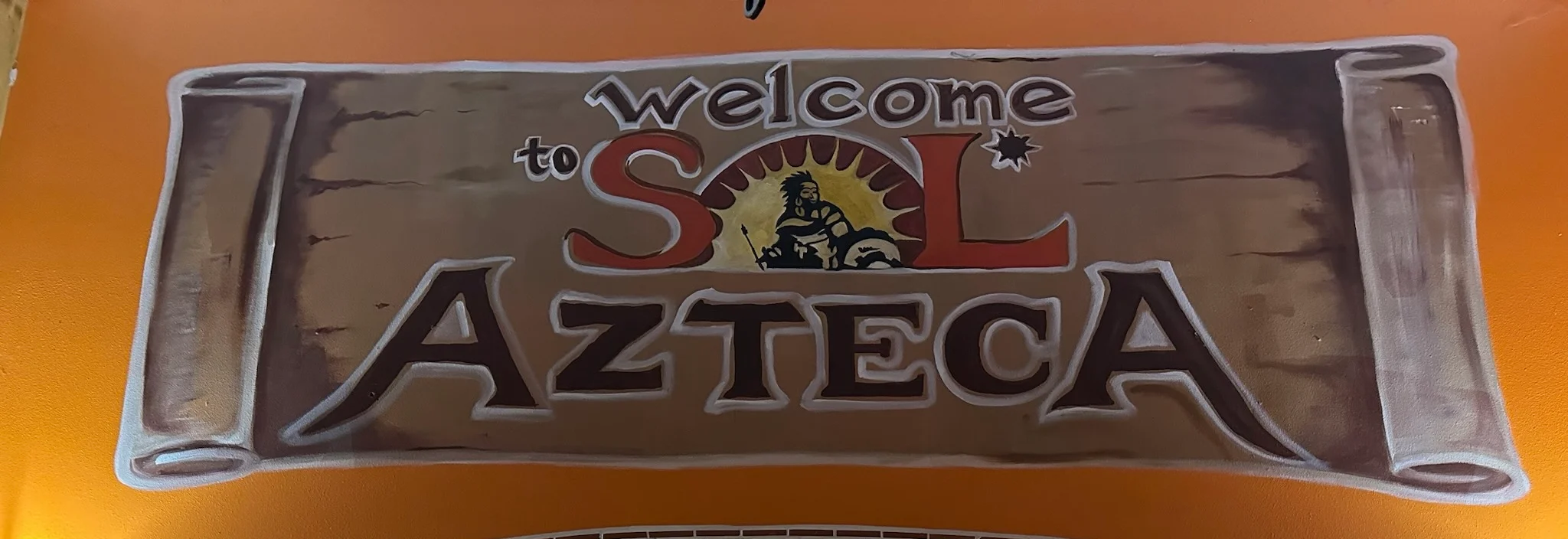 Colorful mural welcoming guests to Sol Azteca restaurant