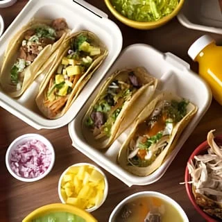 Assorted tacos served in a takeout container
