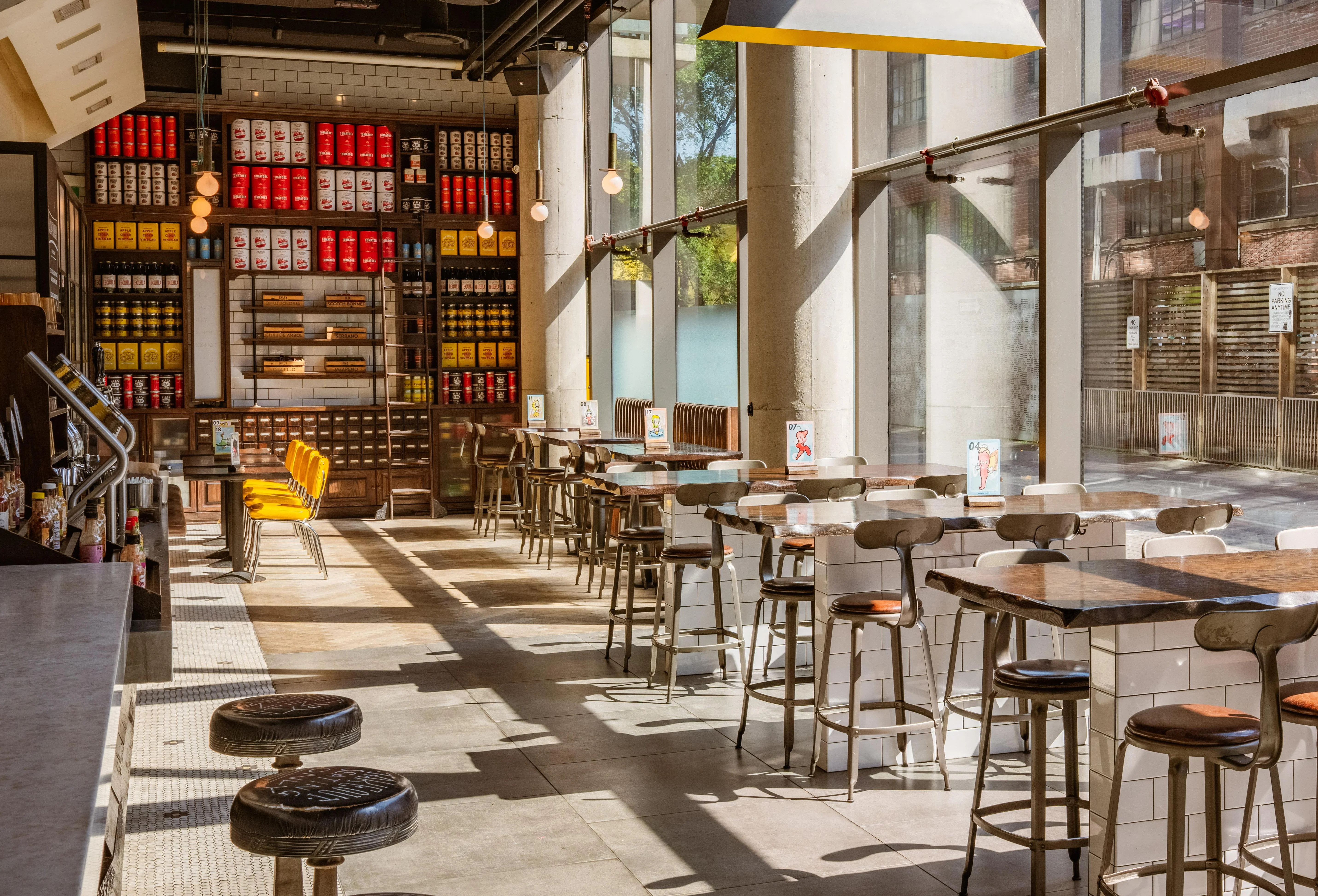 Modern restaurant interior with menu and bar seating