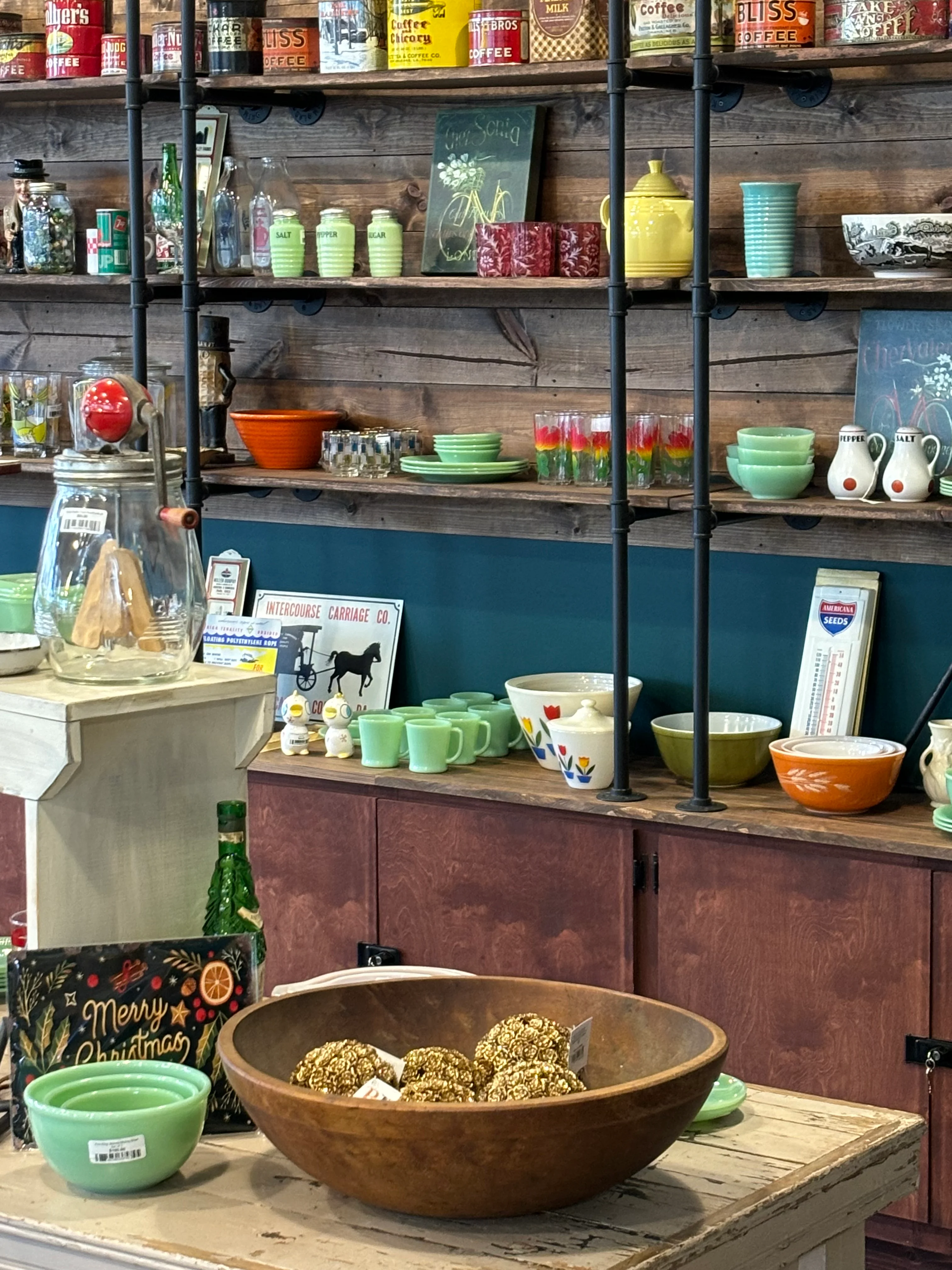 Charming vintage kitchenware display on rustic shelves