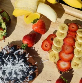 Colorful fruit toast platter with bananas and strawberries