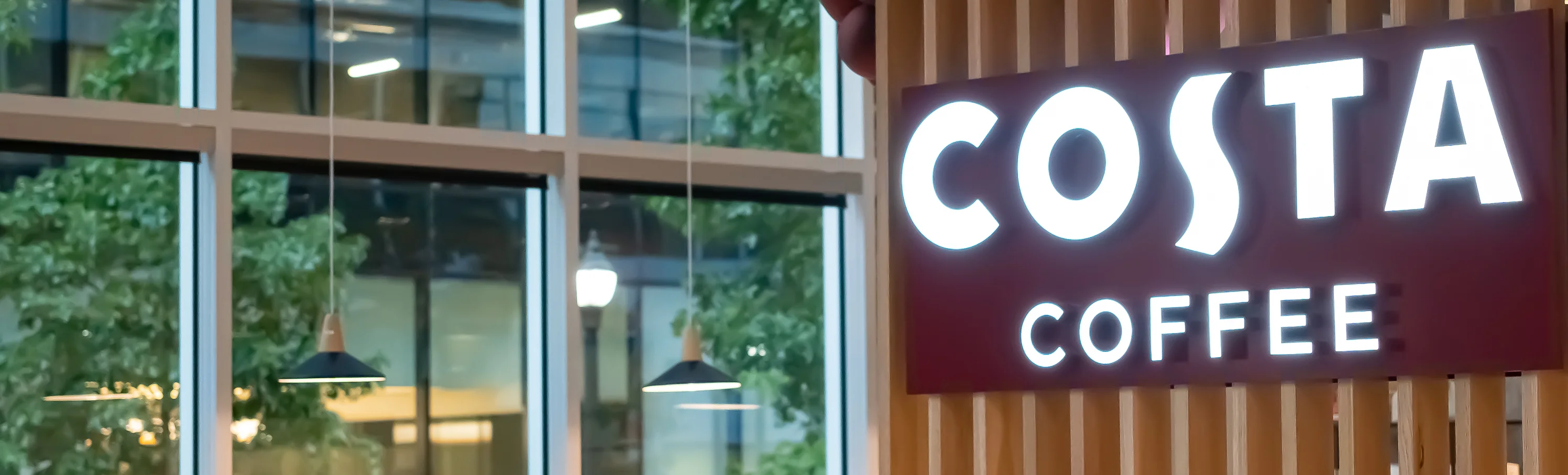 Costa Coffee shop sign in a modern cafe setting