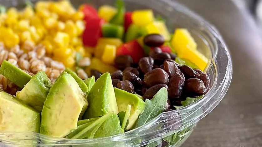 Vibrant Mexican-style grain bowl with fresh vegetables