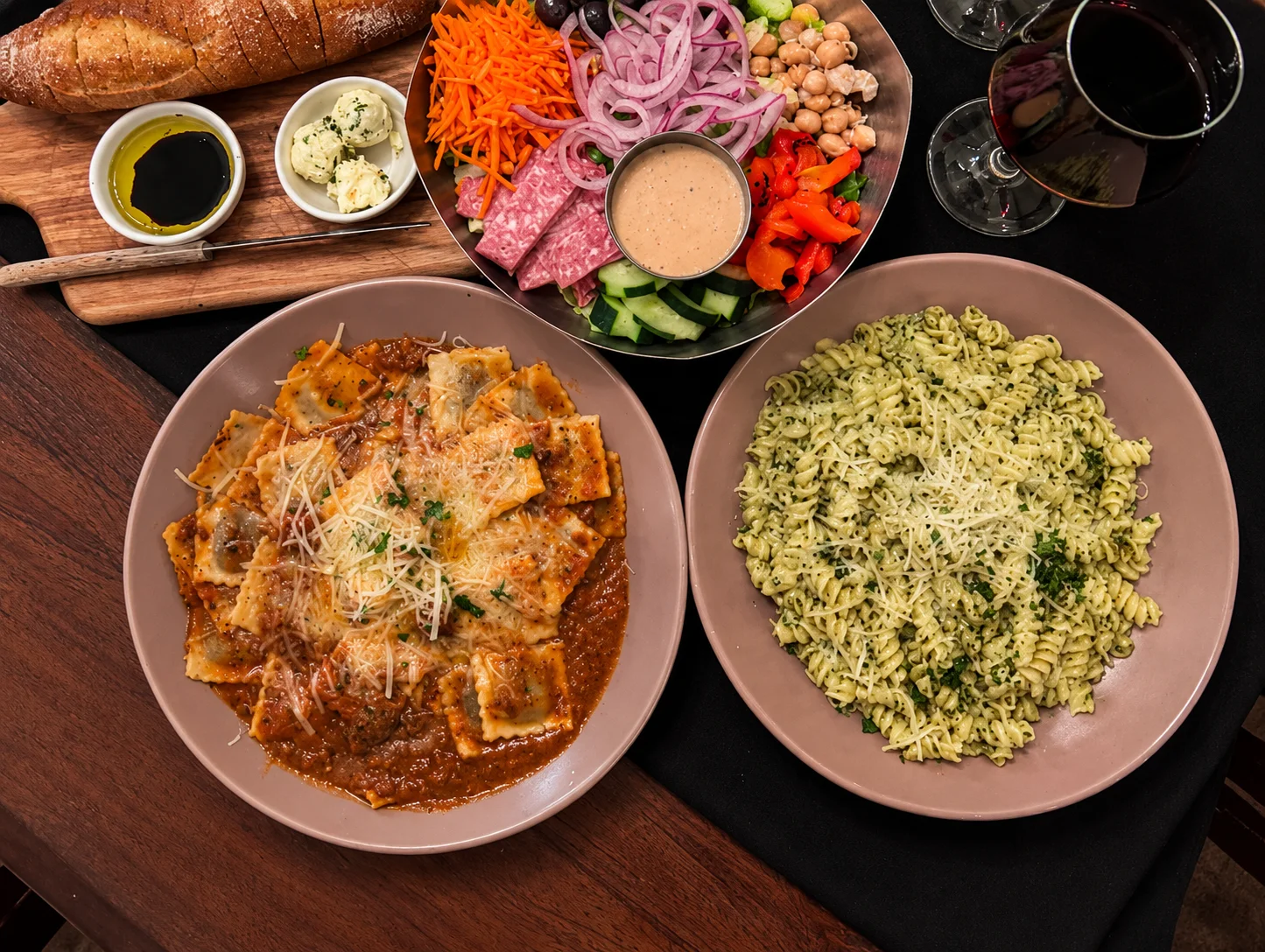 Italian ravioli with marinara sauce and pesto pasta