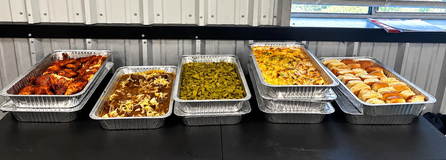 Assorted Southern comfort food in aluminum trays