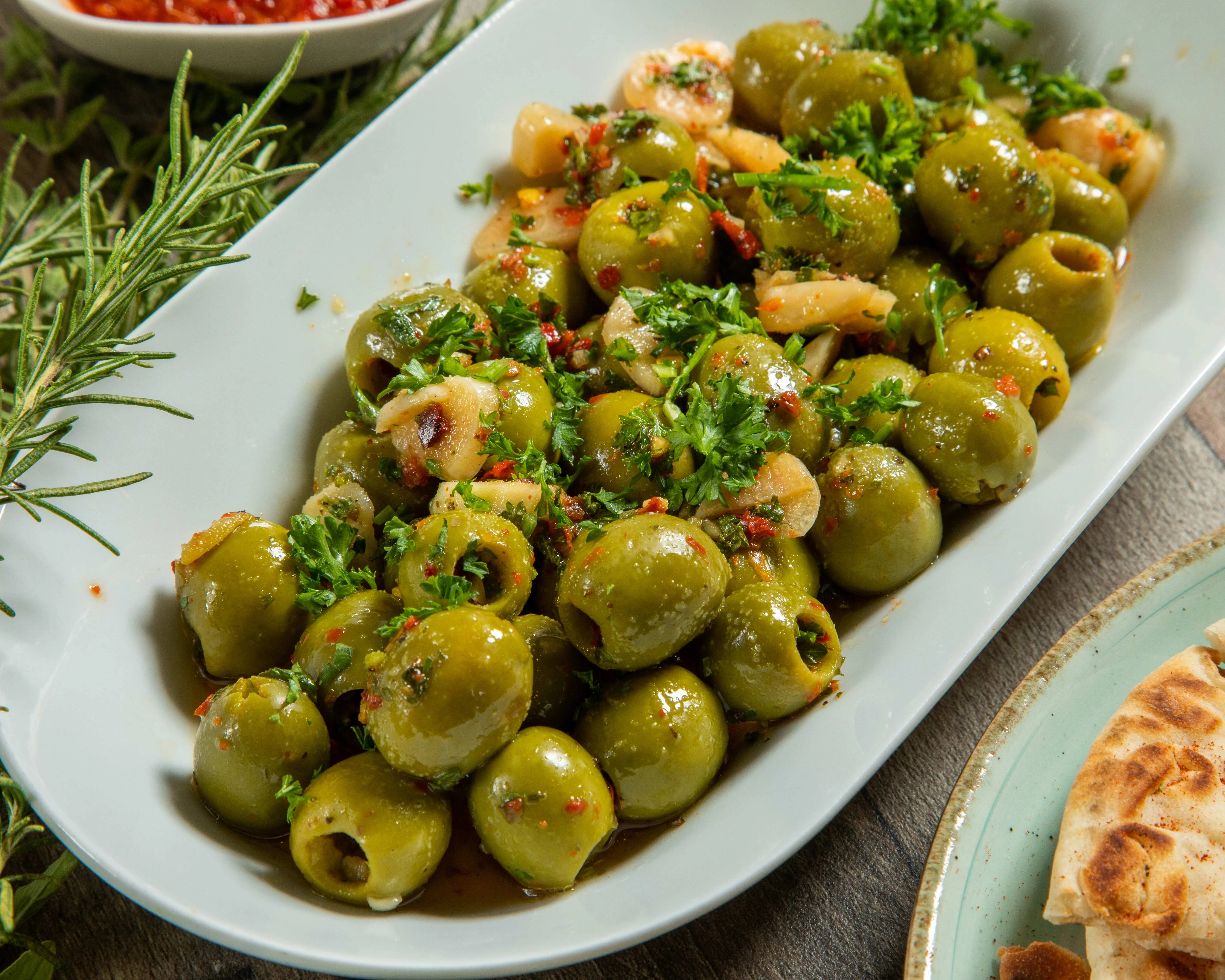 Mediterranean marinated green olives with herbs