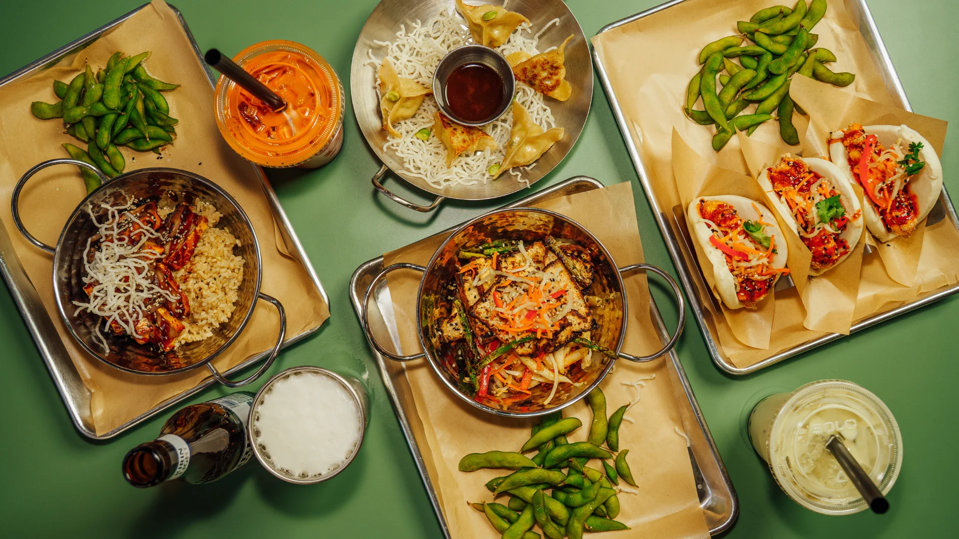 Asian fusion rice bowl with bao buns and dumplings