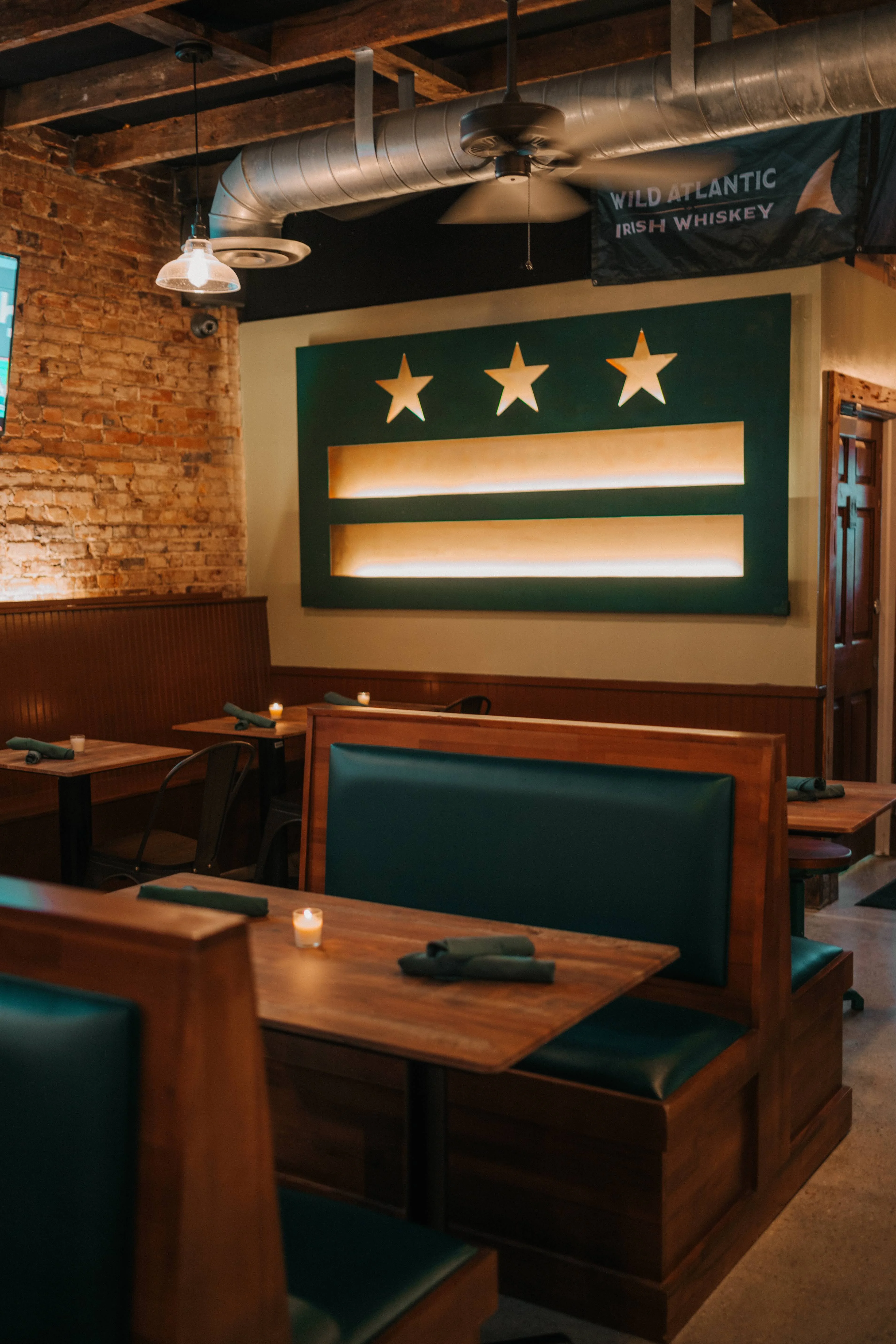 Cozy restaurant interior with wooden booths and warm lighting