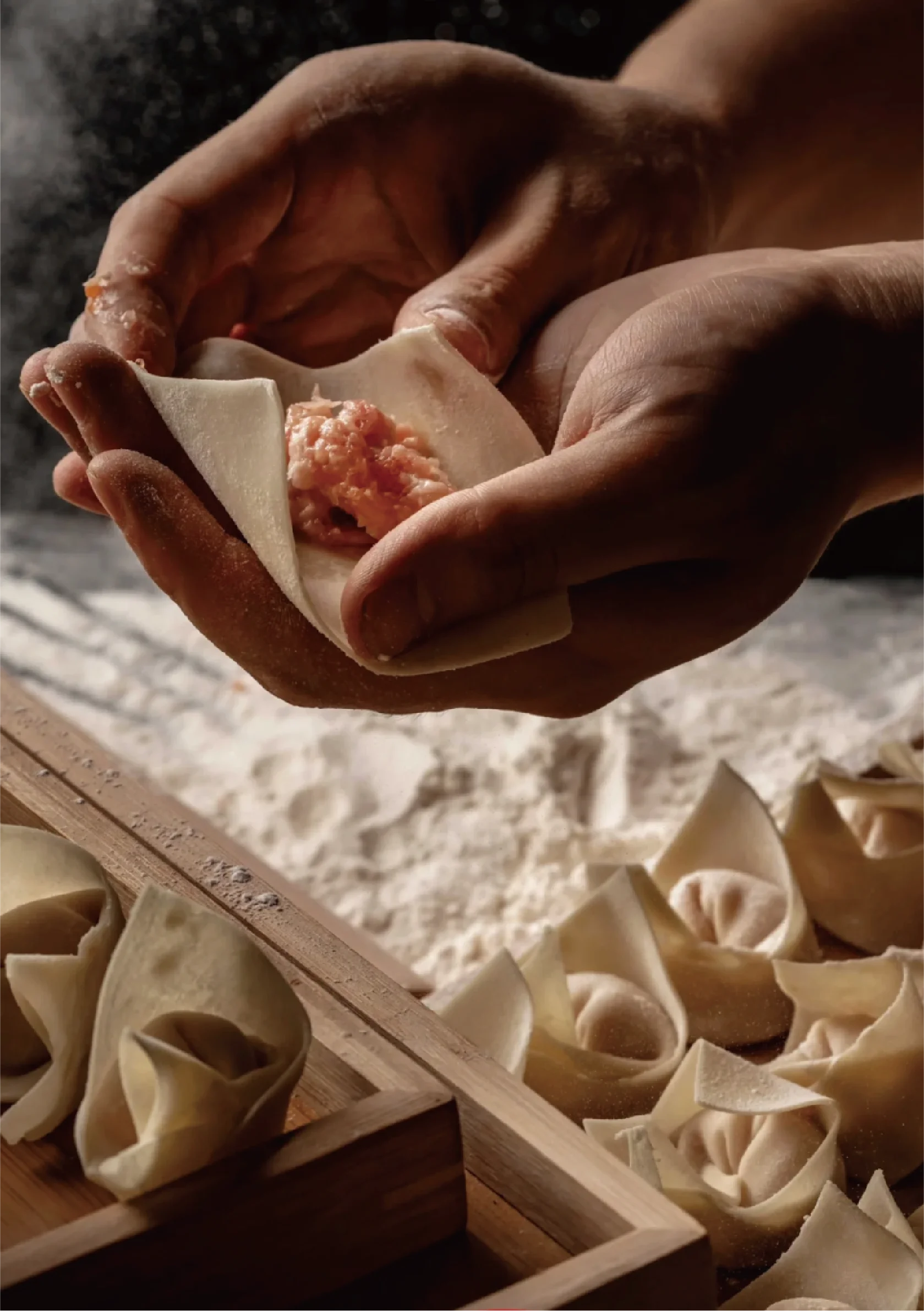 Handmade Chinese dumpling being filled