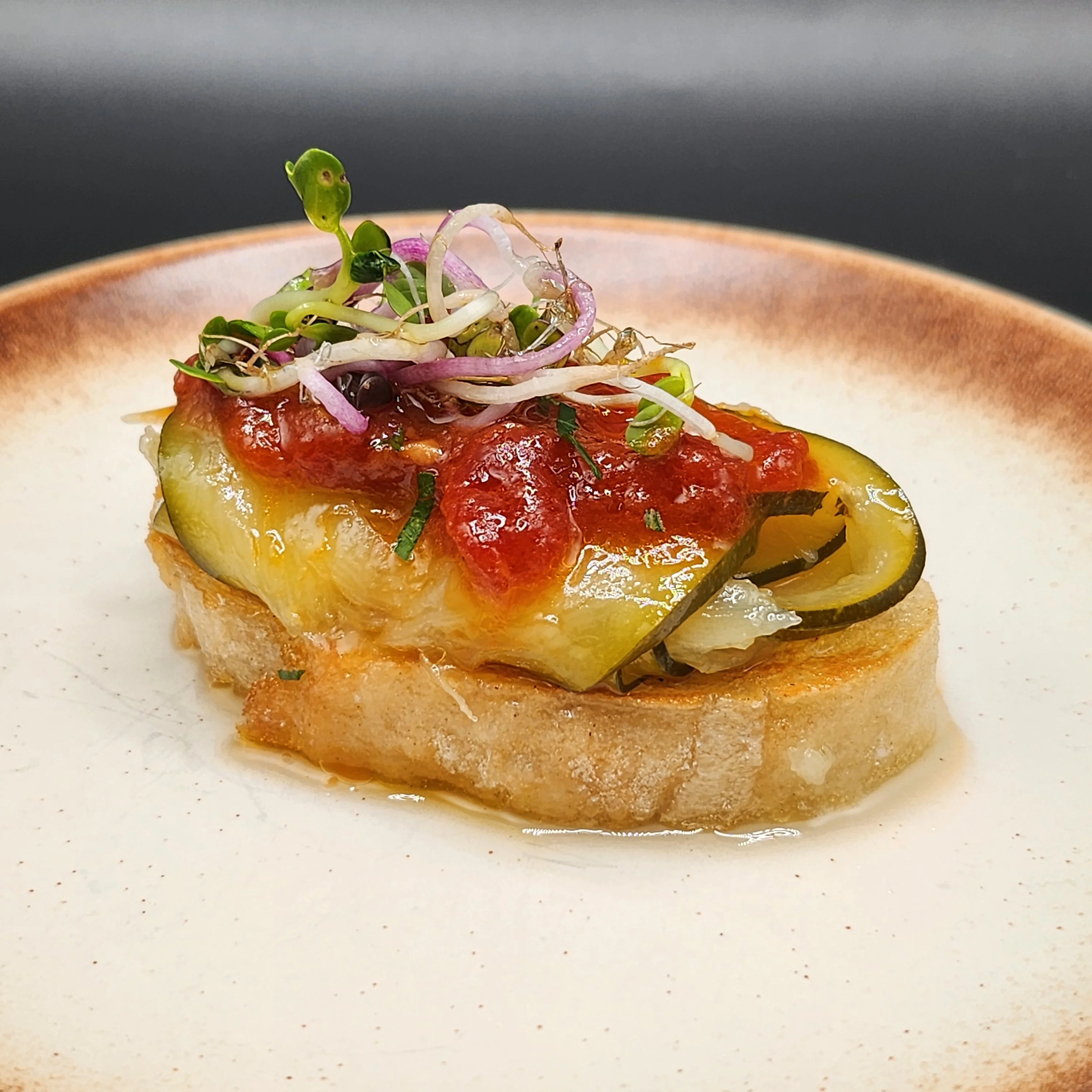 Spanish-style bruschetta with tomato and zucchini