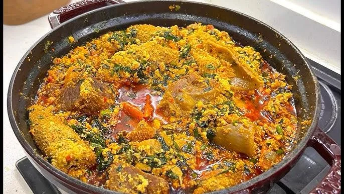 Nigerian egusi soup with assorted meats and vegetables