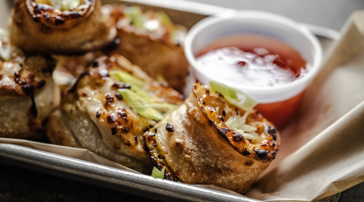 Close-up of crispy Krab Rangoon rolls with creamy crab and cheese filling