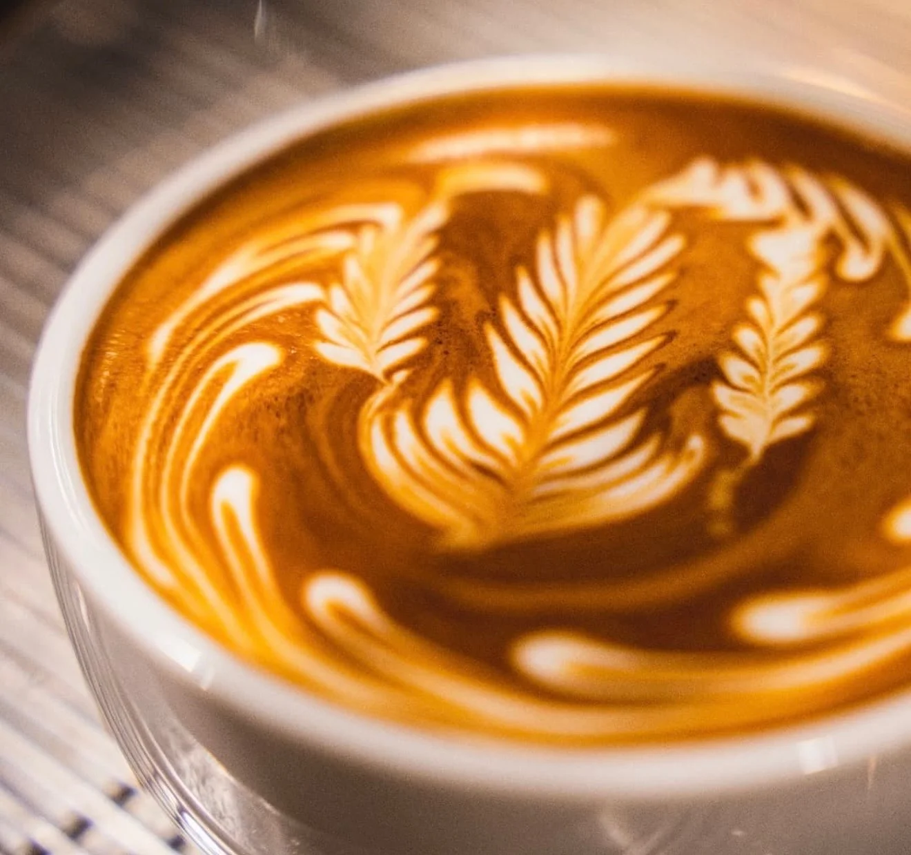 Artisan latte with intricate leaf design