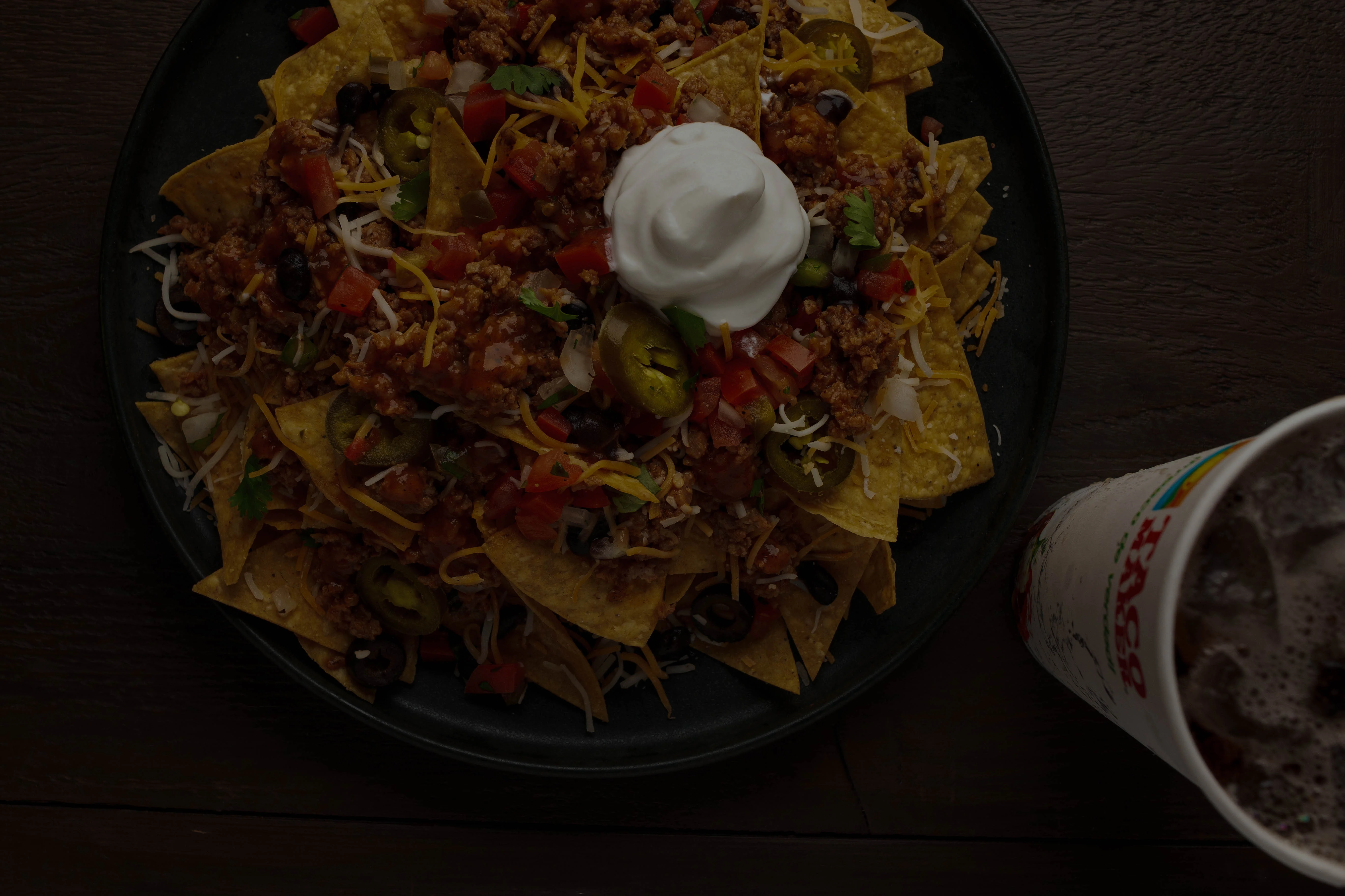 Loaded nachos topped with cheese and salsa