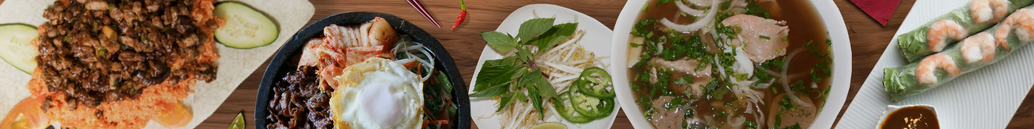 Assorted Vietnamese dishes including pho and spring rolls