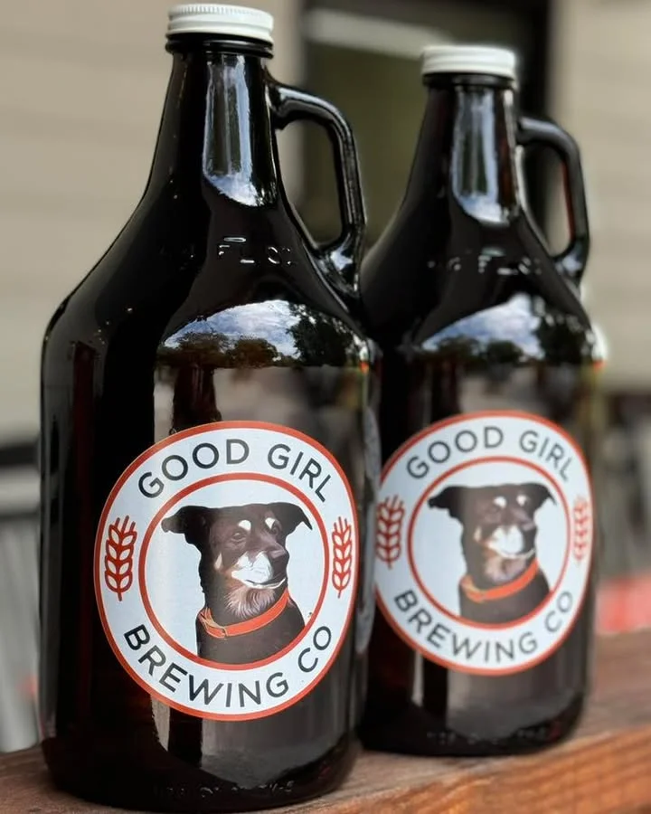 Two growlers from Good Girl Brewing Co with dog logo