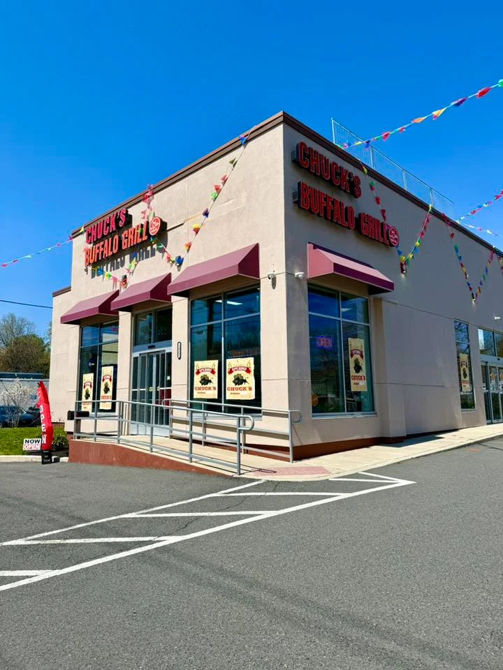 Exterior view of Chuck's Buffalo Grill with colorful decorations.