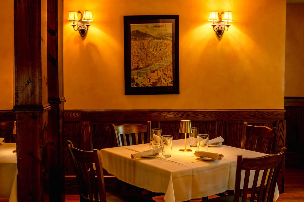 Cozy restaurant interior with warm lighting and wooden accents