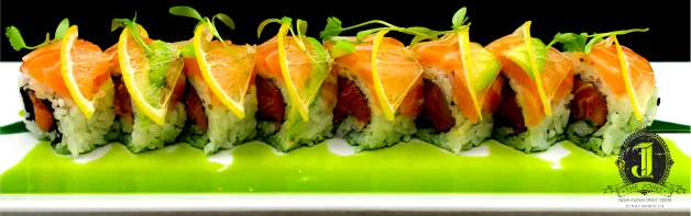 Japanese sushi roll with salmon and citrus garnish