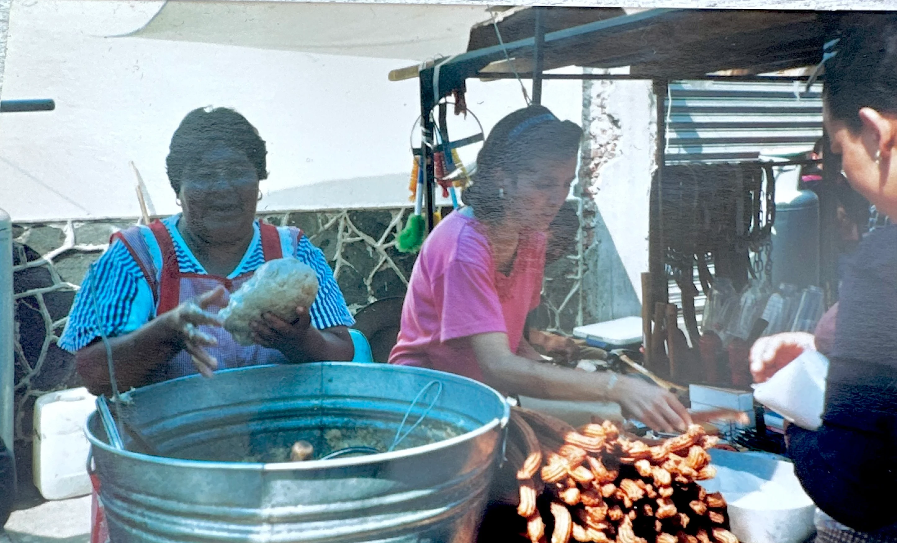 Vibrant street food scene with vendors preparing traditional snacks