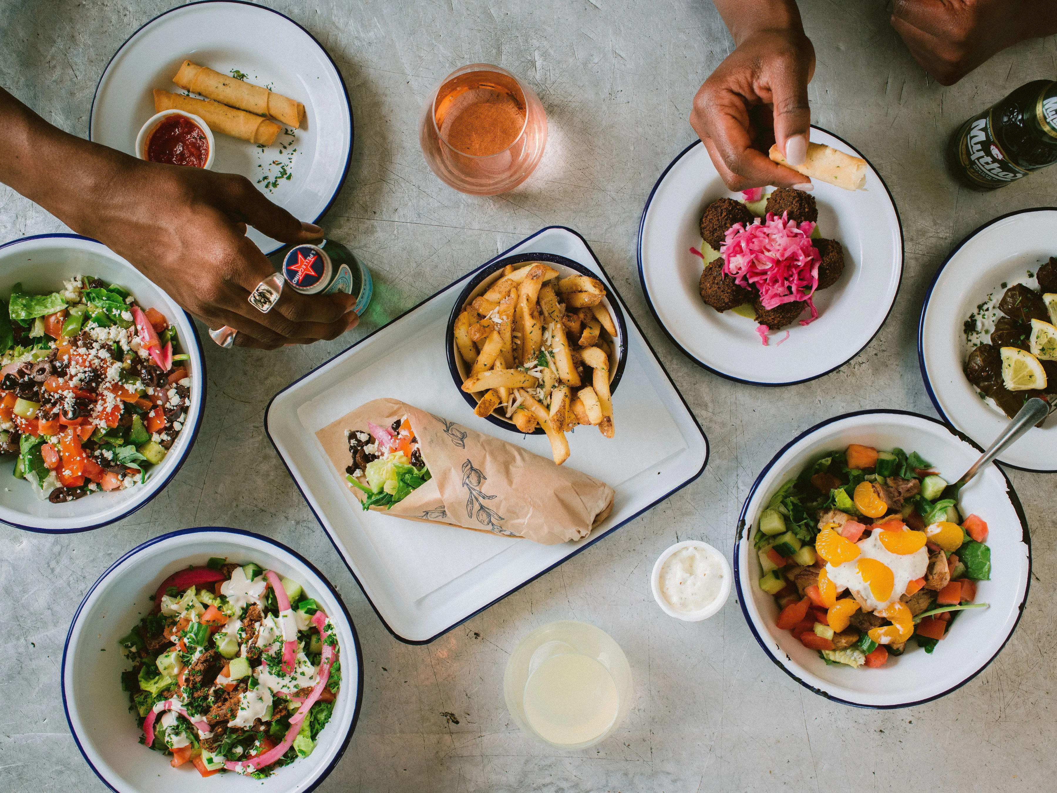 Mediterranean feast with falafel, salads, and fries