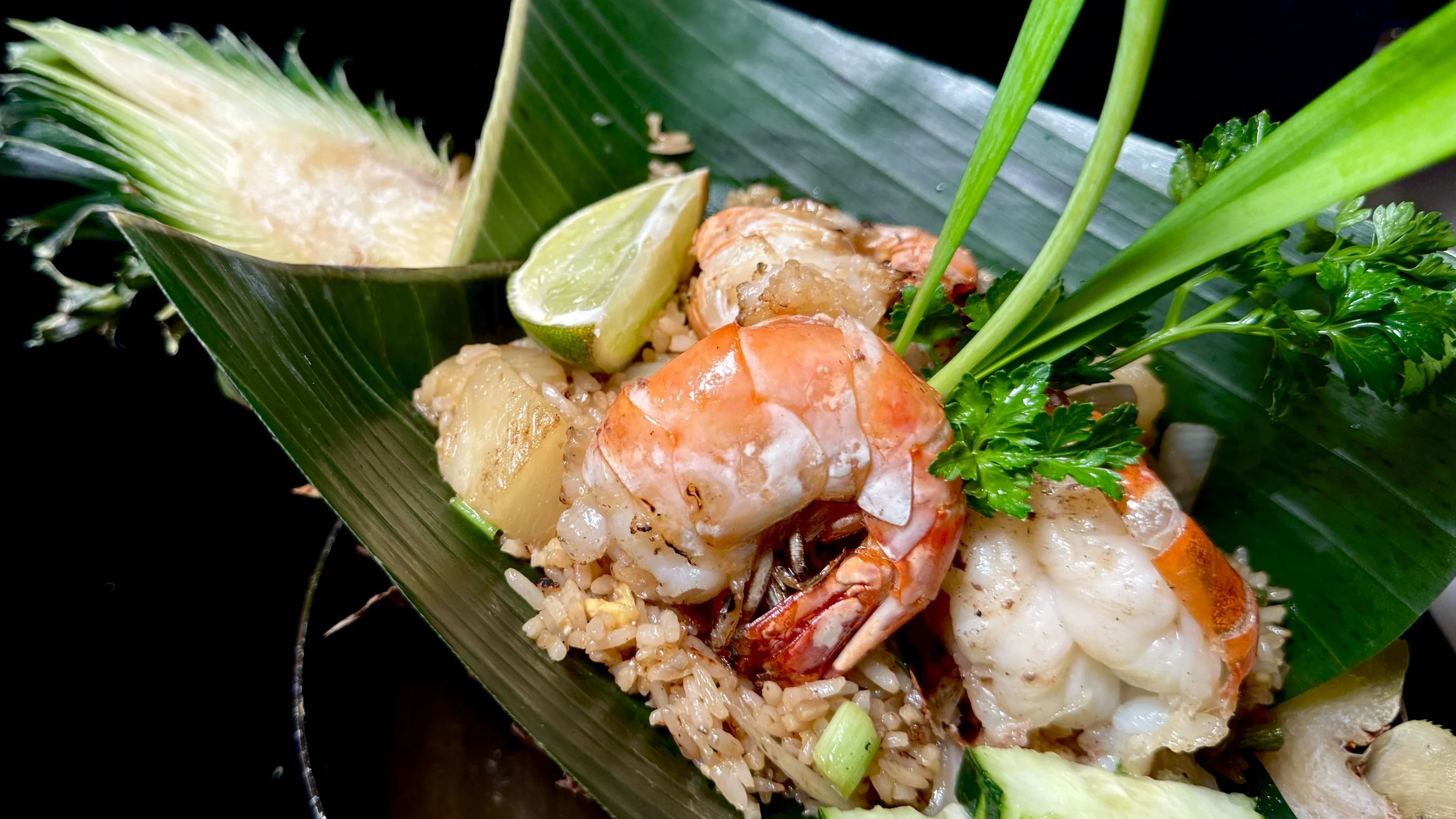 Thai shrimp fried rice served in a banana leaf