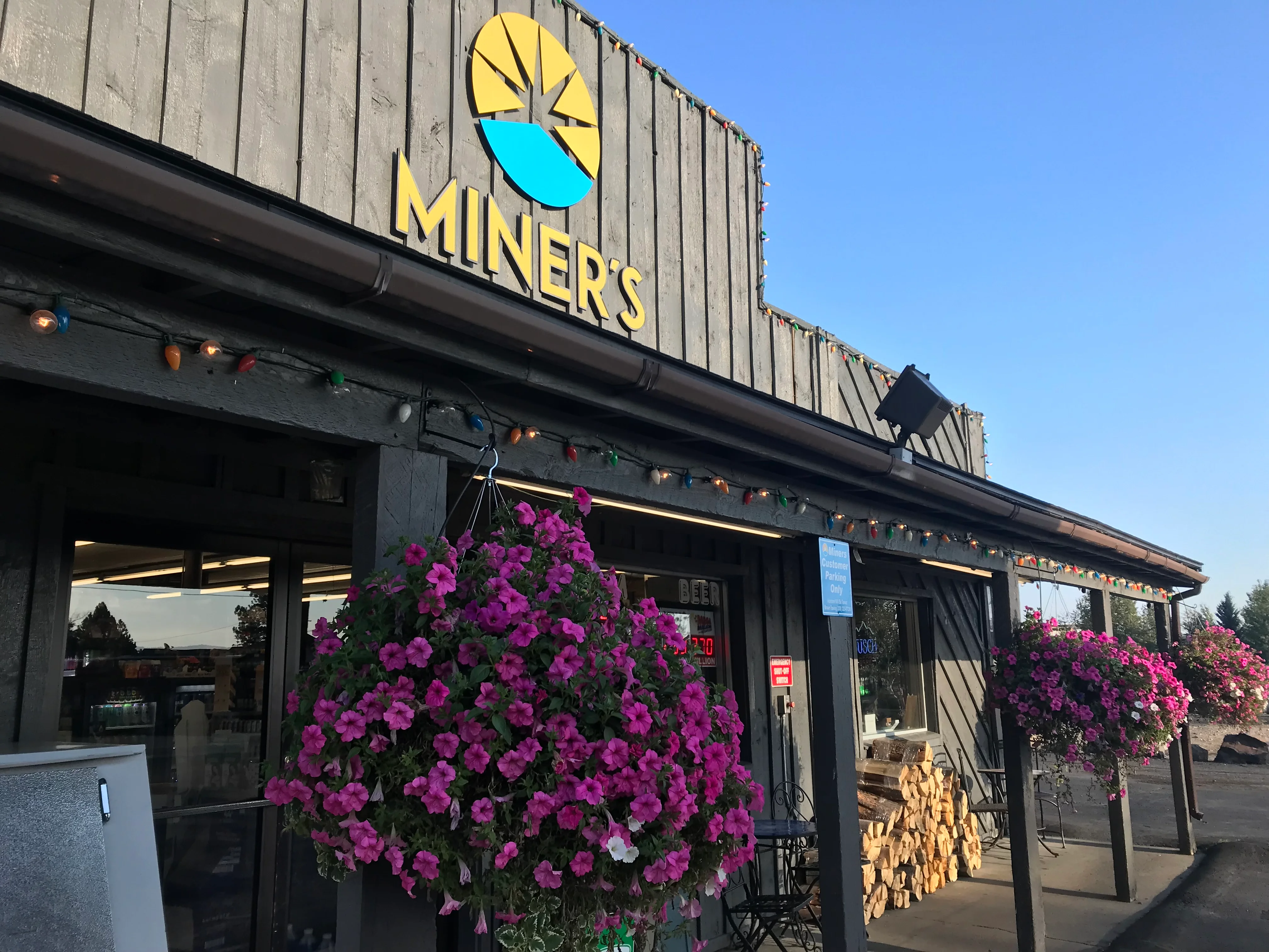 Charming restaurant exterior with vibrant flowers and rustic decor