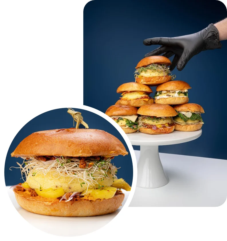 Artisan gourmet burgers stacked on a display stand