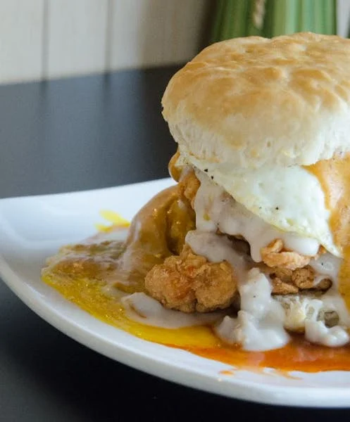 Southern chicken biscuit sandwich with gravy and egg